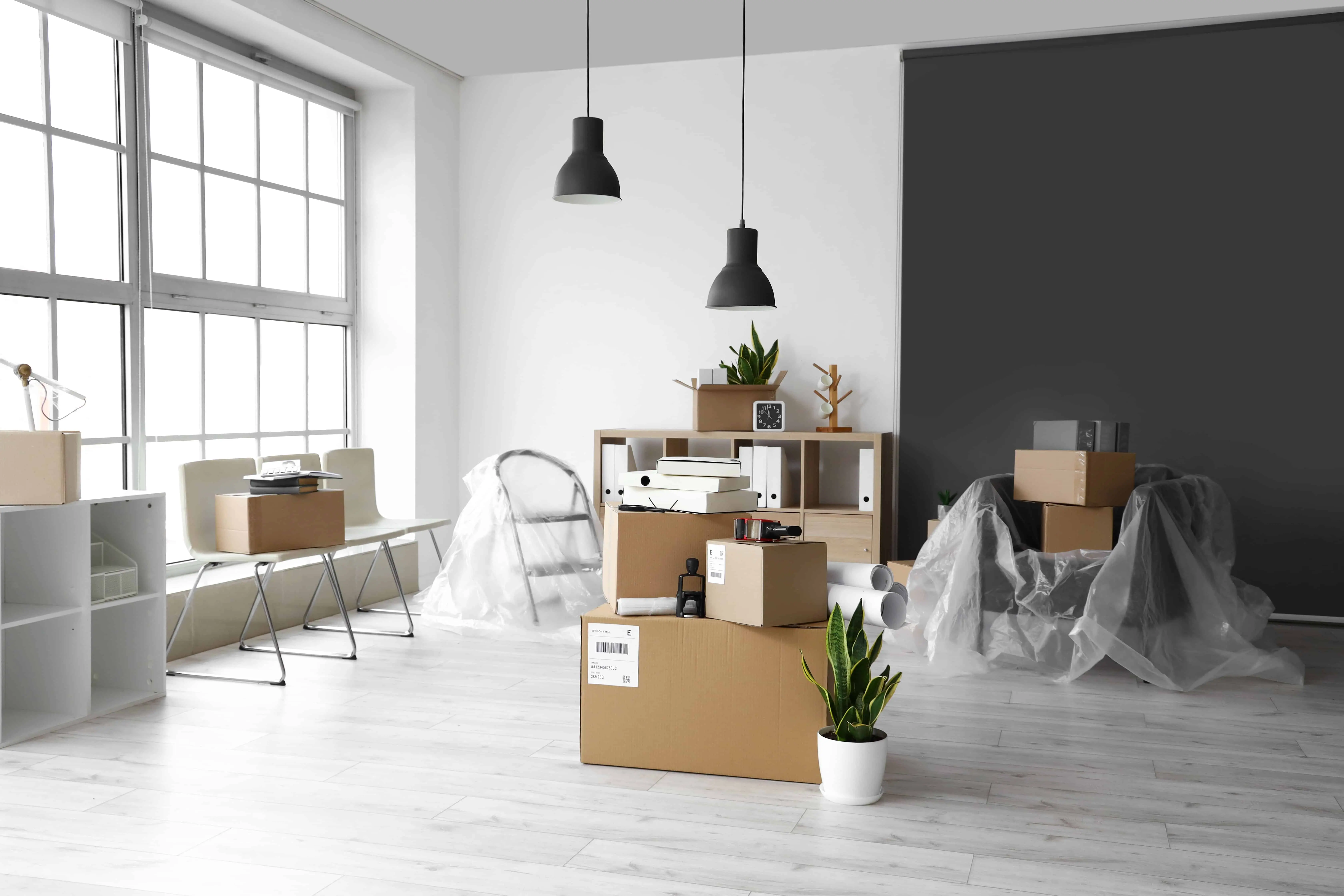 Cardboard boxes with belongings in an office during a move