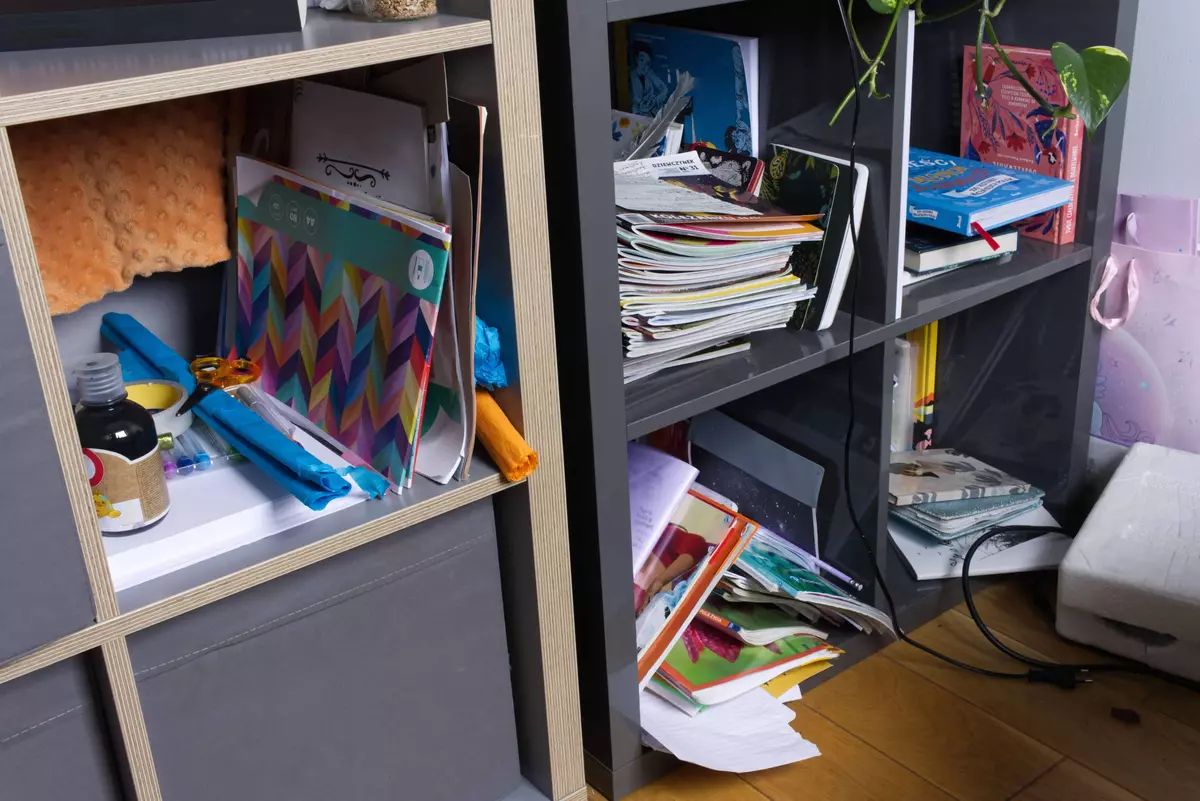 Messy teenage room with cluttered shelves