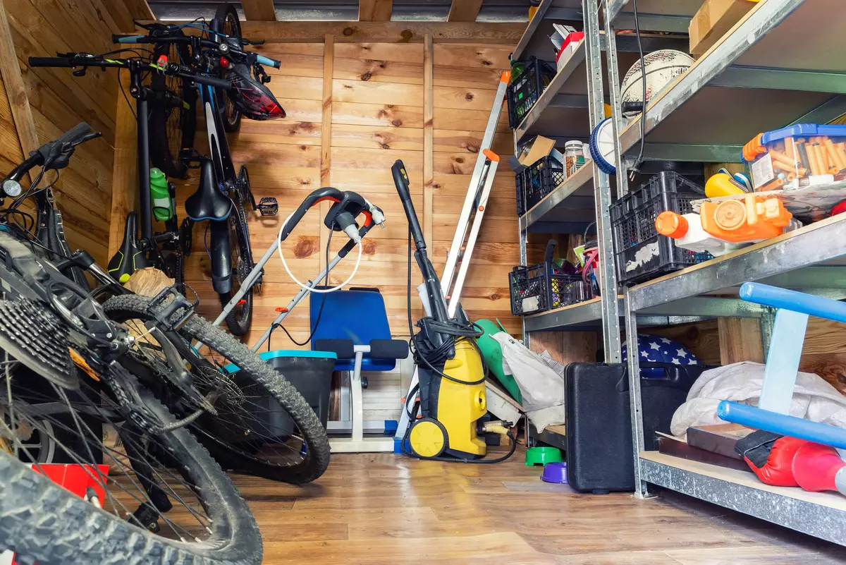 Storage shed with bikes and tools in disarray